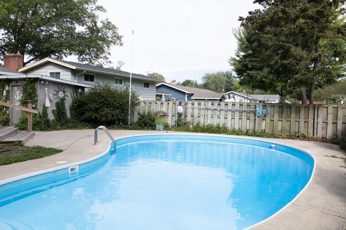 Sparkling in-ground pool on a sunny day